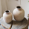 Set of textured ceramic jar vases with speckled rim and rounded bulb shape