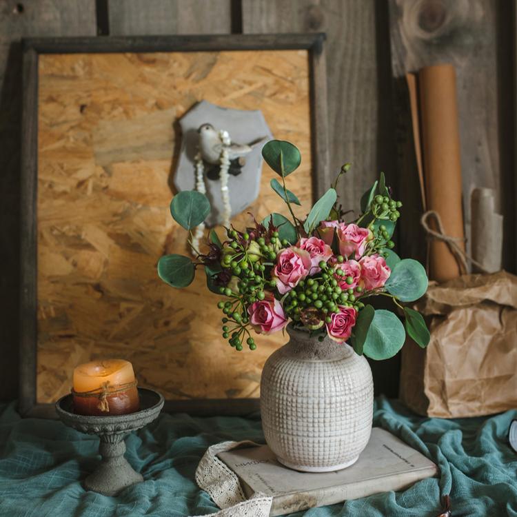 Textured ceramic jar vase with open top, patterned surface, and rounded silhouette
