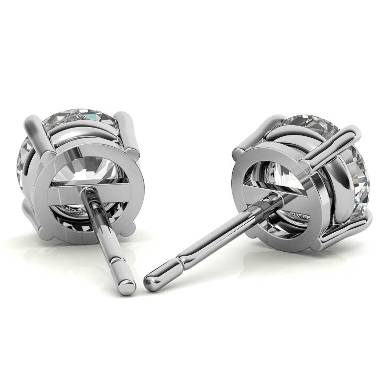 Round diamond stud earrings with hinged back and posts in white gold