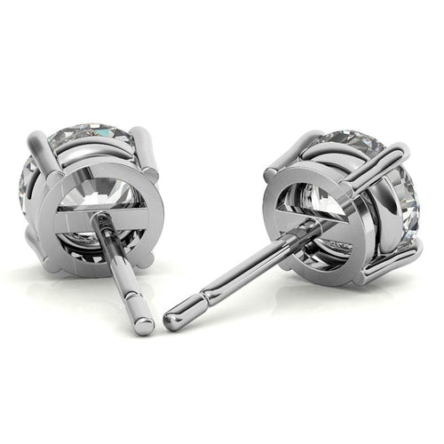 Round diamond stud earrings with hinged back and posts in white gold