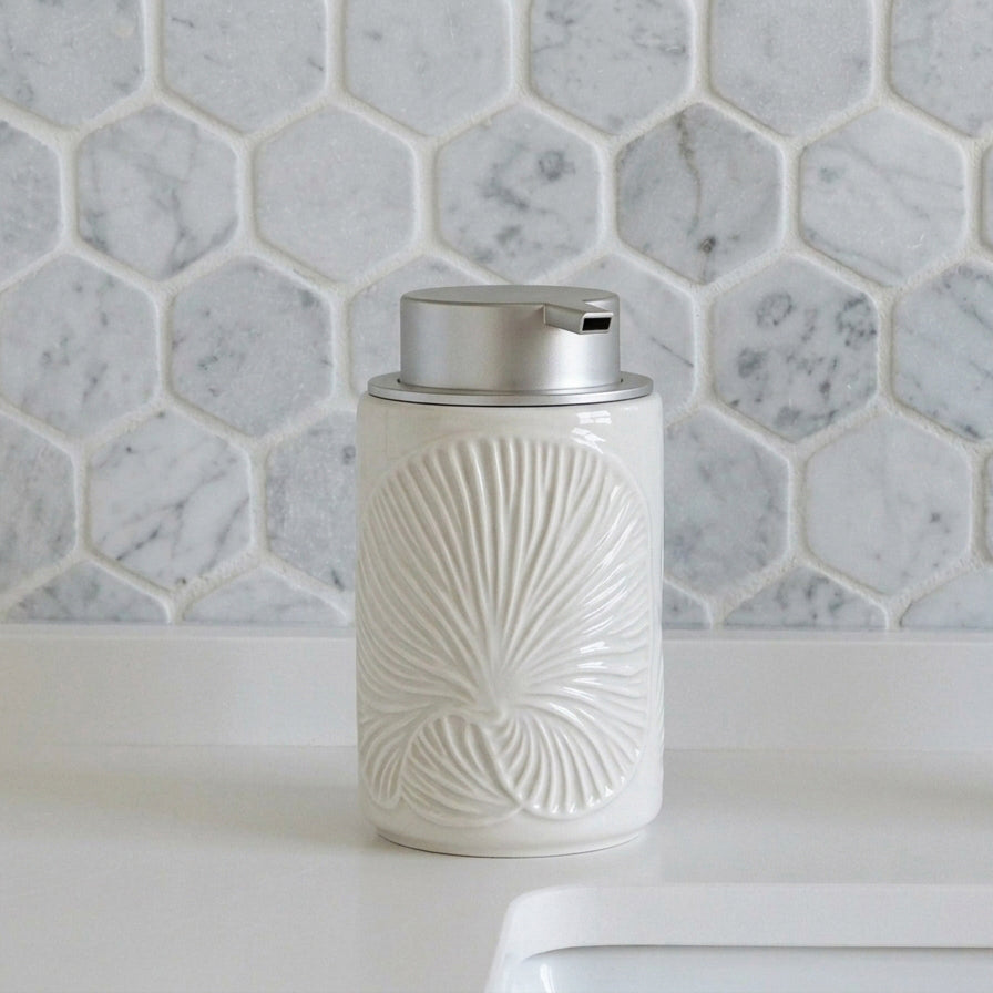 White ceramic foaming soap dispenser with silver pump and vertical embossed floral texture