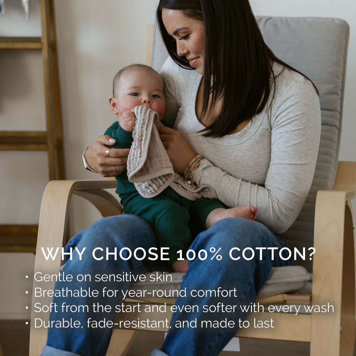 Muslin burp cloth held while supporting a seated baby