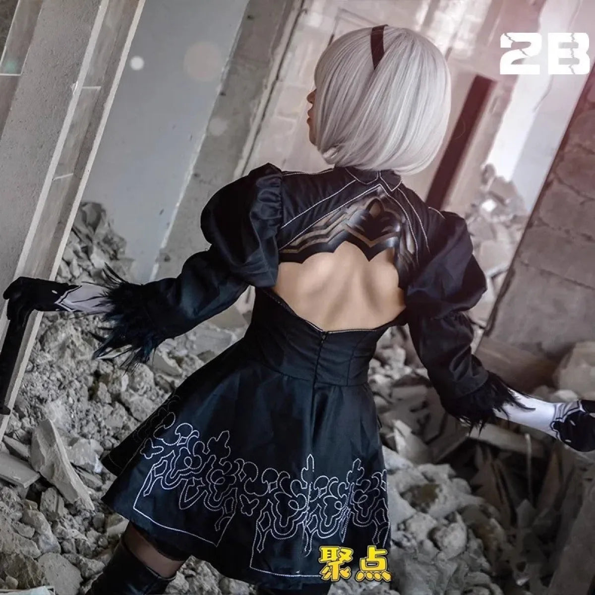 Black 9S-style cosplay outfit with open back, long gloves, and silver wig