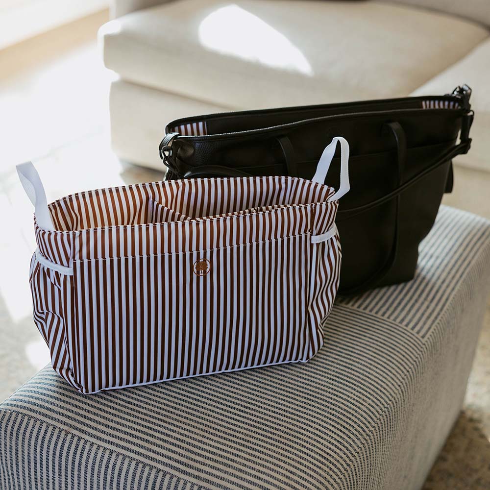 Brown-and-white striped tote bag with top zipper and short carry handles