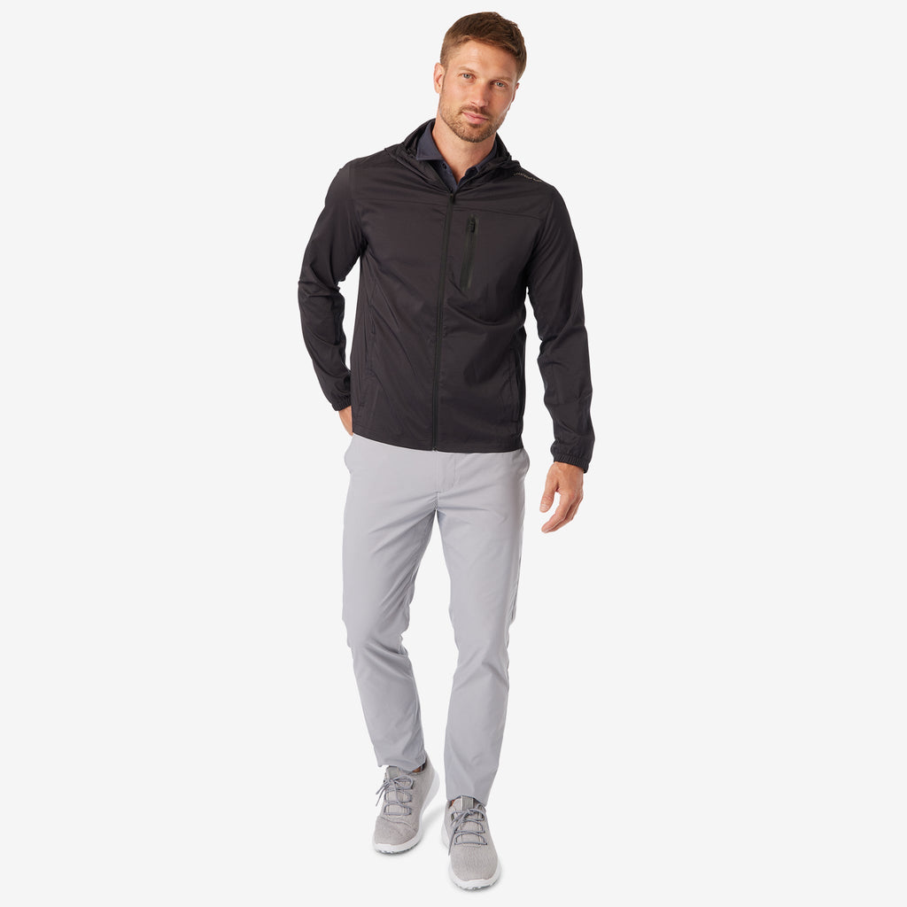 Black windbreaker jacket with hood, full-zip front, and hip pockets, standing pose
