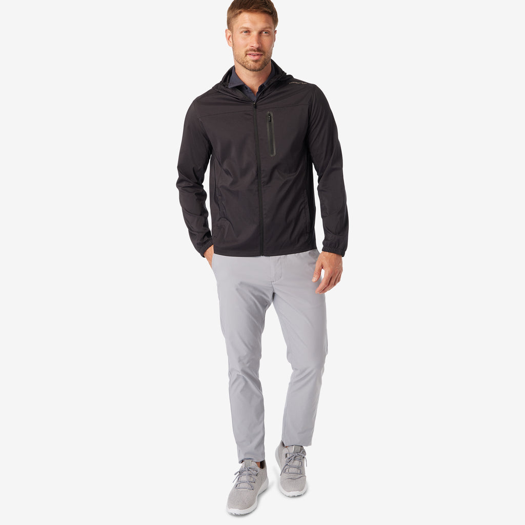 Black windbreaker jacket with hood and full-zip front, side view
