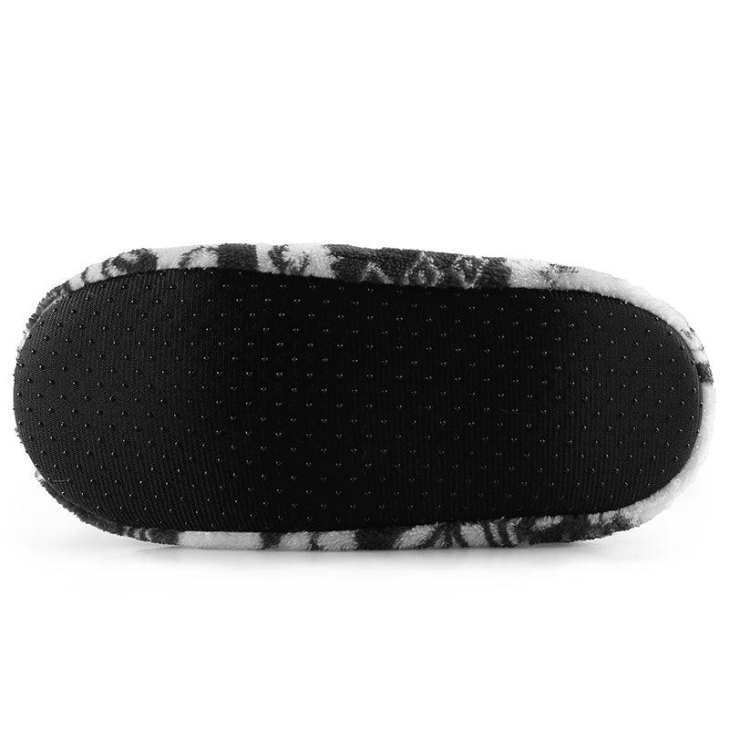 Women's slipper outsole with black non-slip tread and patterned fabric edge