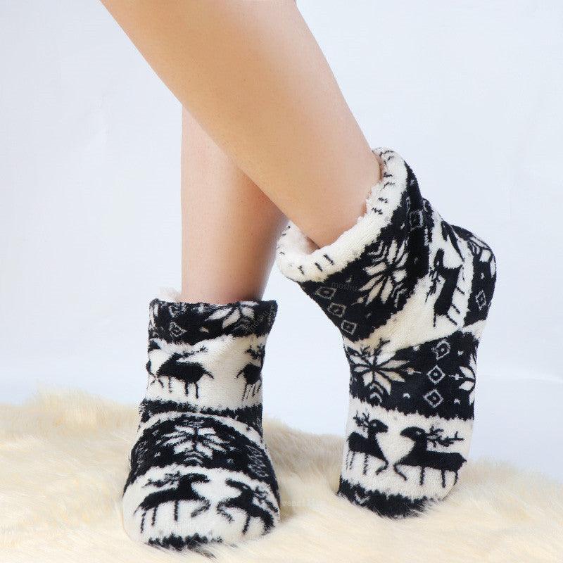 Women’s plush winter slipper boots, black and white reindeer pattern