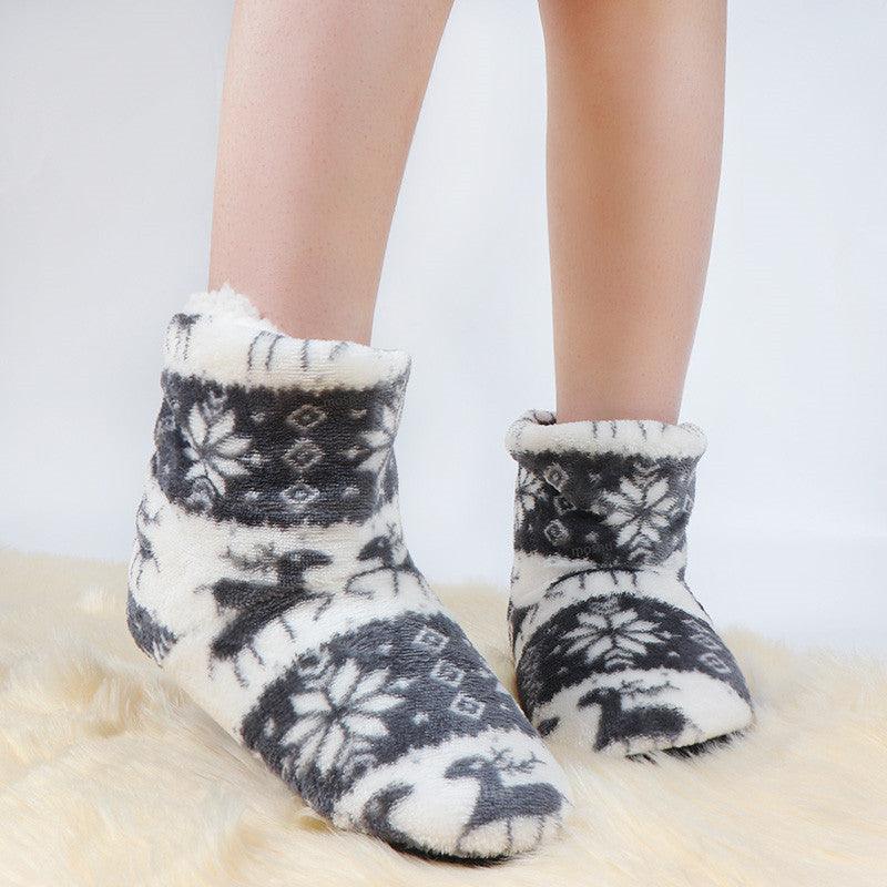 Women’s plush winter slipper boots, black and white reindeer pattern