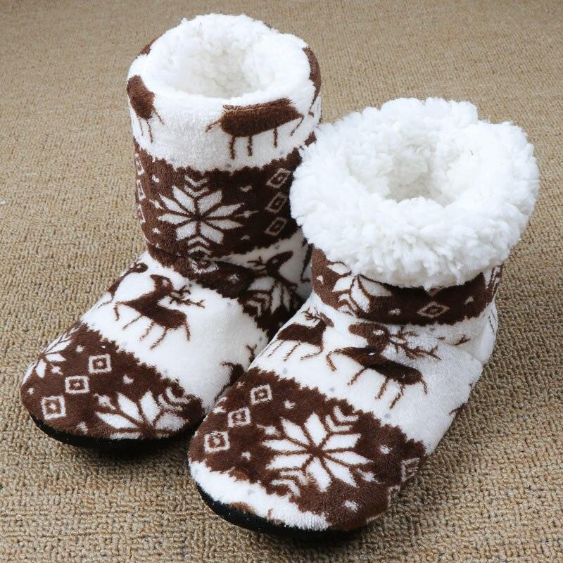 Brown and white plush slipper boots with fleece lining and winter reindeer snowflake pattern