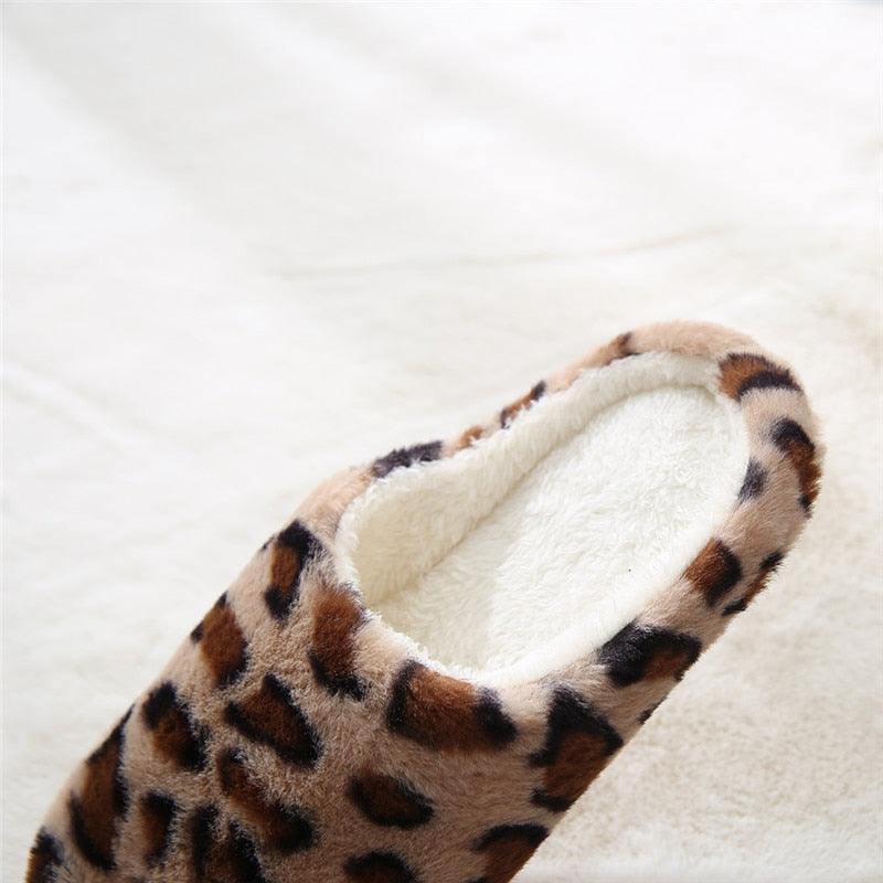 Side view of tan and brown leopard-print plush slip-on slippers