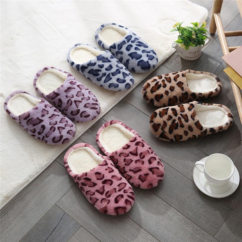 Women's fuzzy slip-on slippers set in pink, blue, and brown leopard prints