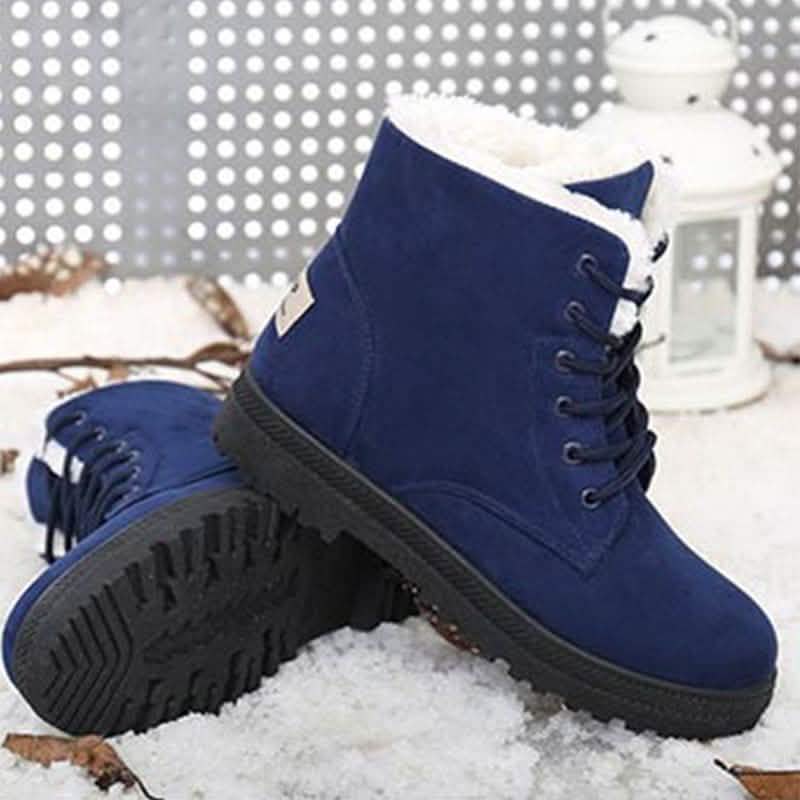 Blue lace-up winter boots with faux-fur lining and rugged dark rubber outsole