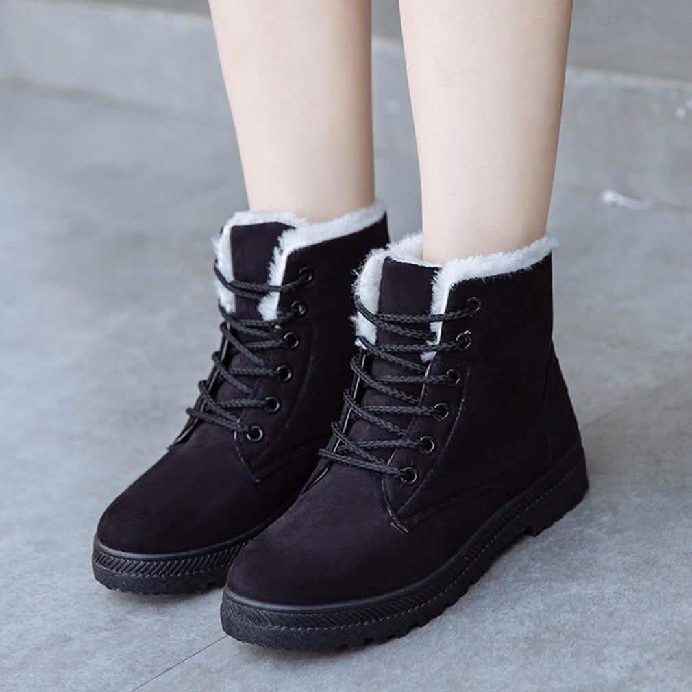 Black lace-up winter ankle boots with faux-fur lining and dark treaded rubber sole