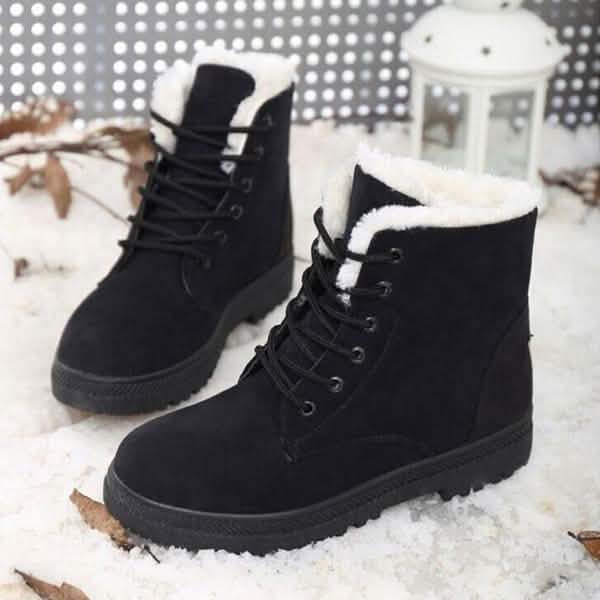 Black winter boots with lace-up design, faux-fur trim at the top, and rugged sole