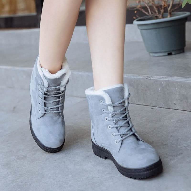 Winter short flat boots in light gray suede with lace-up front and fluffy white lining