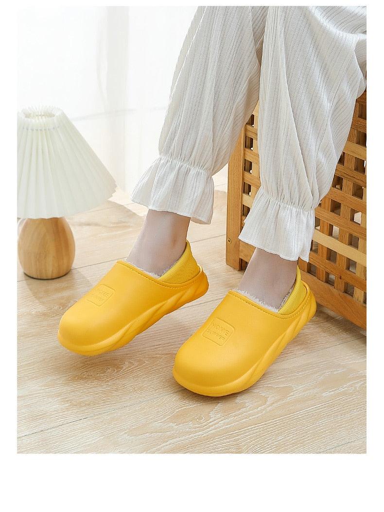 Yellow plush-lined slip-on home slippers with cushioned sole