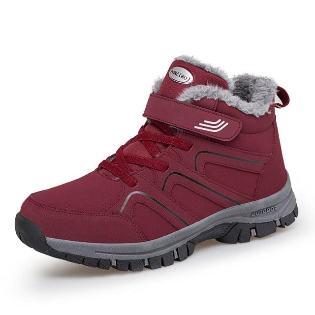 Red lace-up ankle winter boots with plush lining and chunky anti-slip sole.