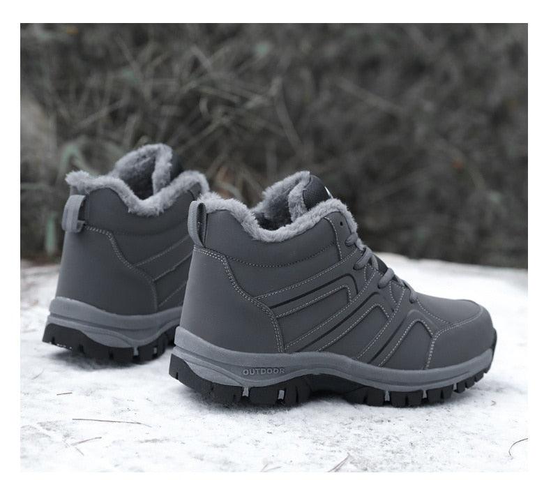 Grey plush-lined lace-up winter ankle boots with padded collar and grippy outsole
