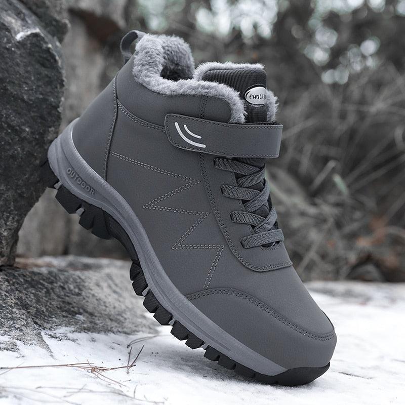 Grey plush-lined lace-up winter ankle boots with padded collar and rugged tread outsole