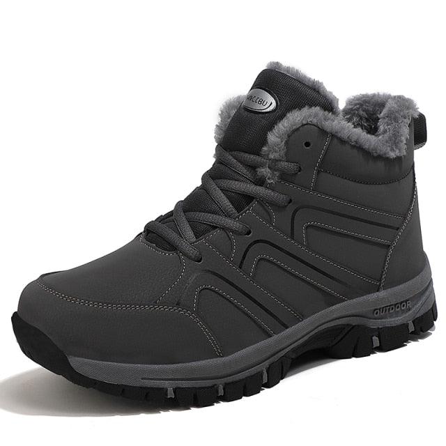 Black plush-lined lace-up winter ankle boot with padded collar and rugged tread sole