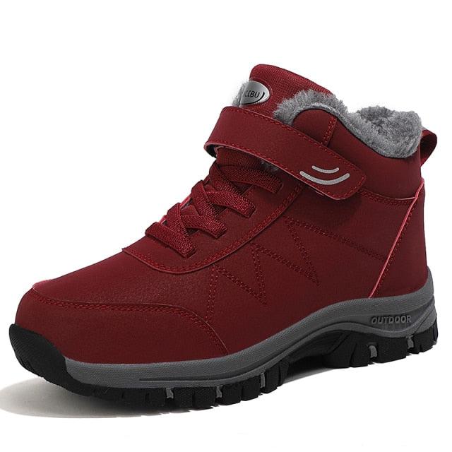 Red plush-lined lace-up winter ankle boot with padded collar and chunky tread sole