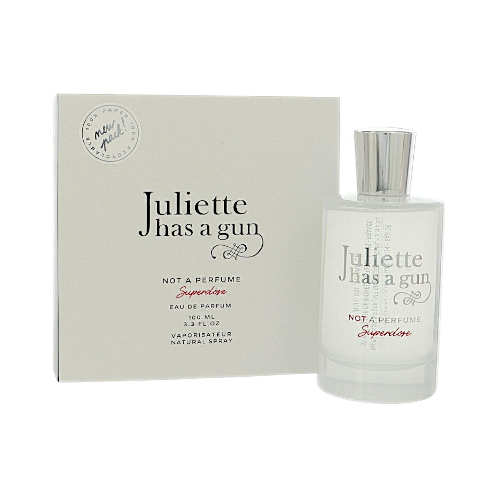 Eau de parfum spray set showing box and clear bottle with tall silver cap