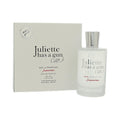Eau de parfum spray set showing box and clear bottle with tall silver cap