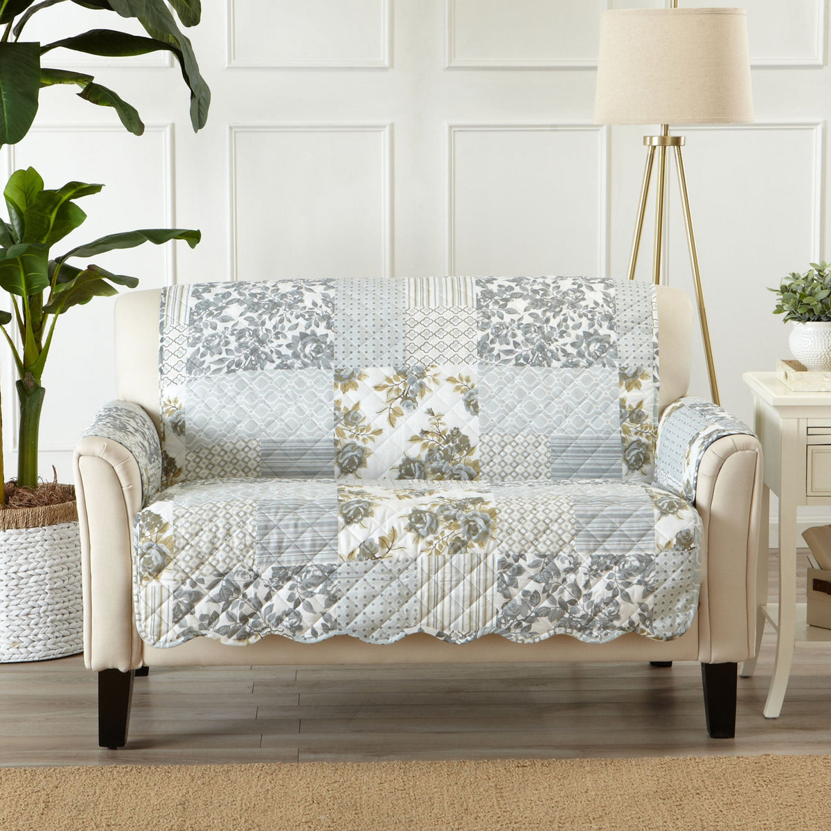 Reversible furniture protector for loveseat, gray white patchwork with floral accents across top