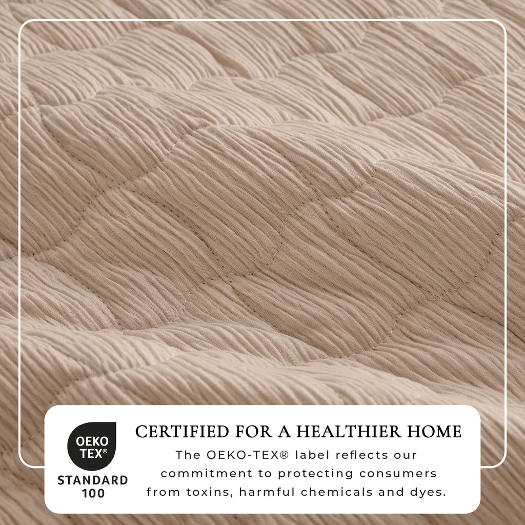 Light beige gauze quilt set close-up, wave-stitch quilting with raised fabric rows