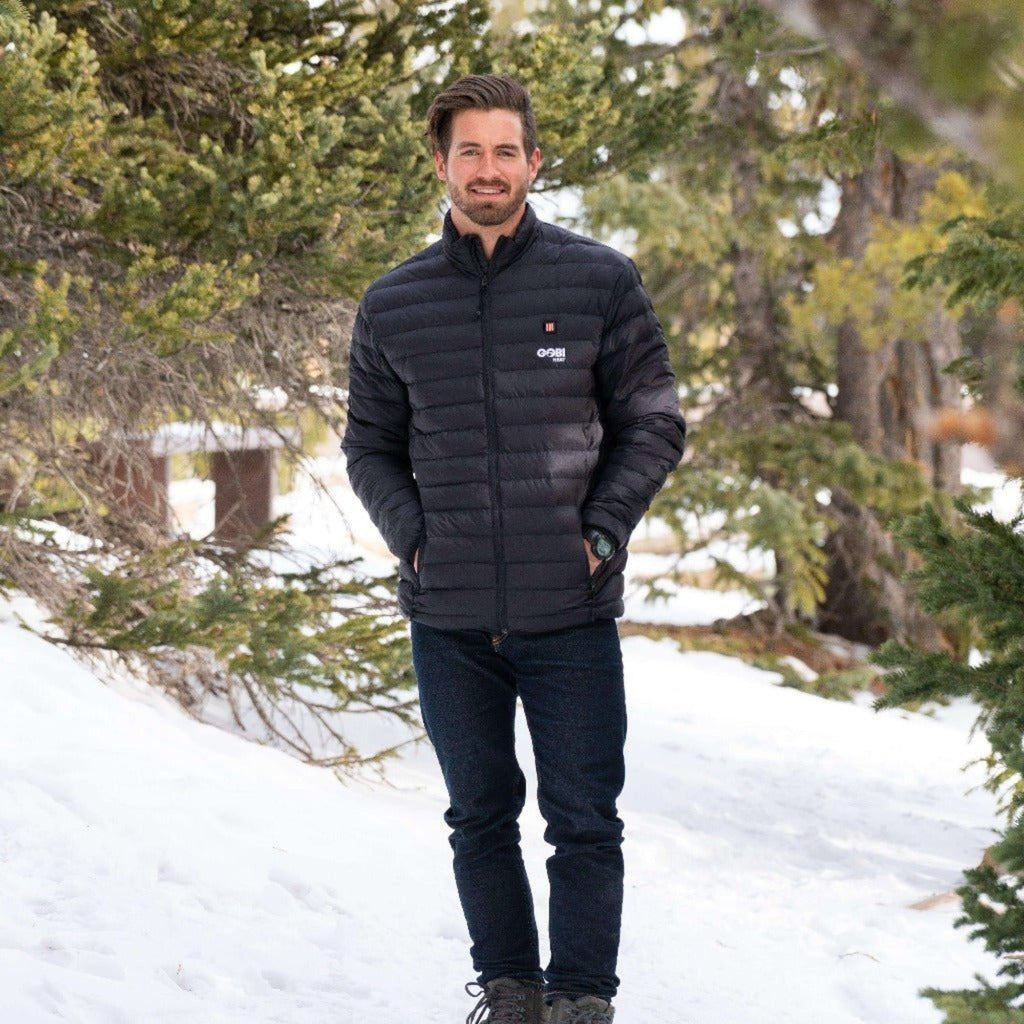 Men's black heated puffer jacket, full-zip, standing view