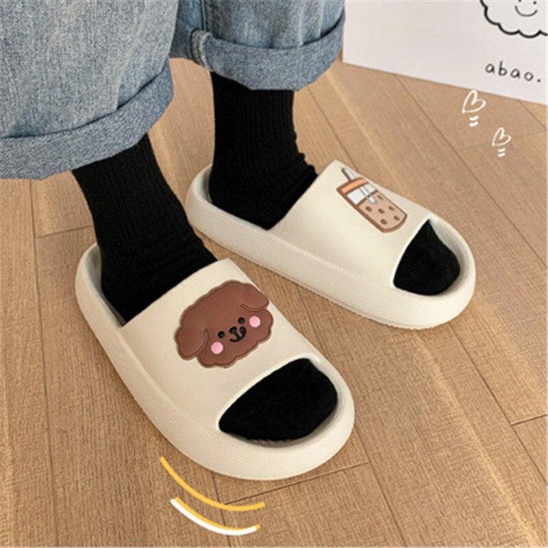 Women’s open-toe slide slippers in cream with paw patch and black straps