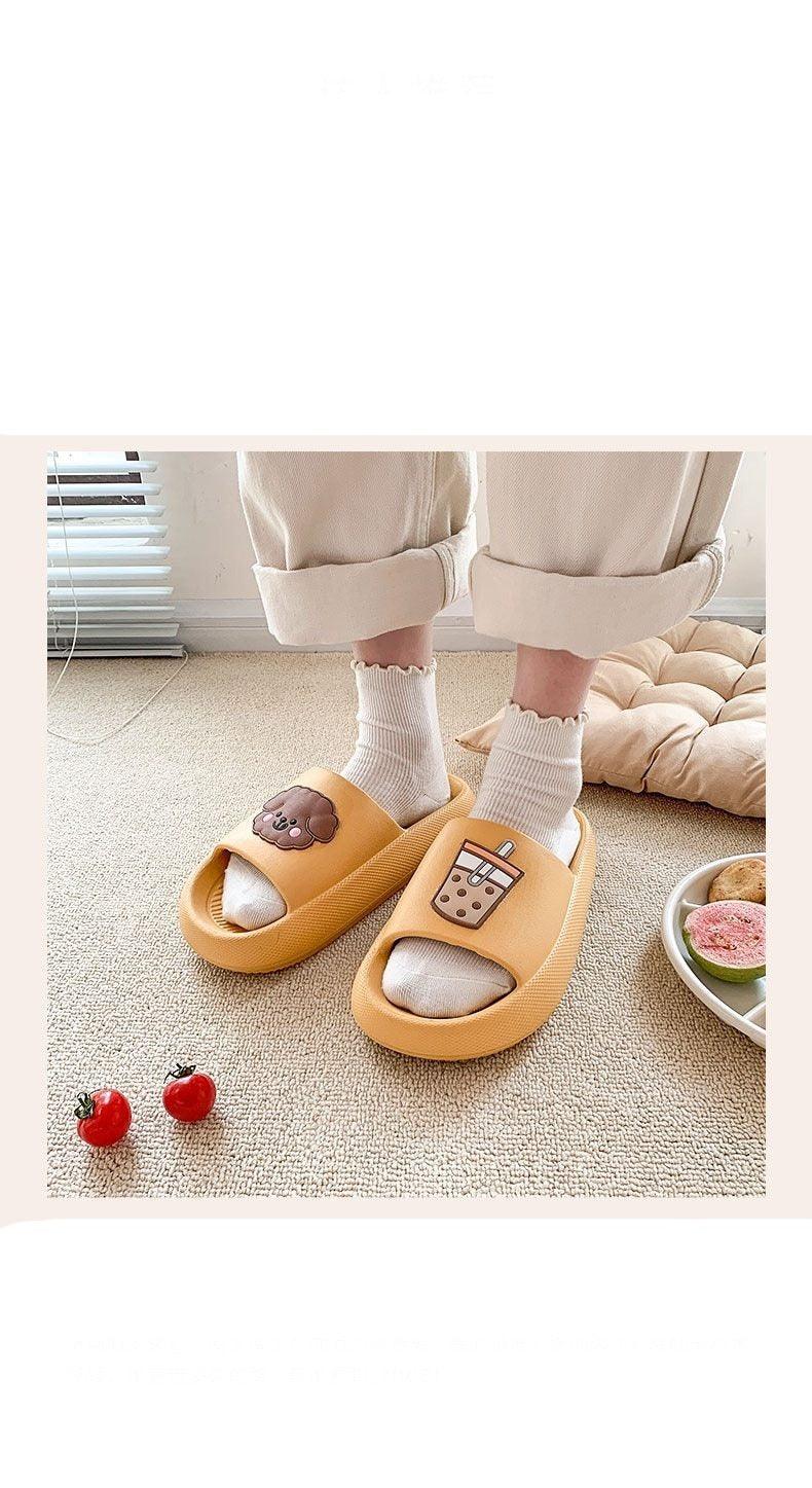 Women’s yellow open-toe slide slippers with soft sole and bear patch