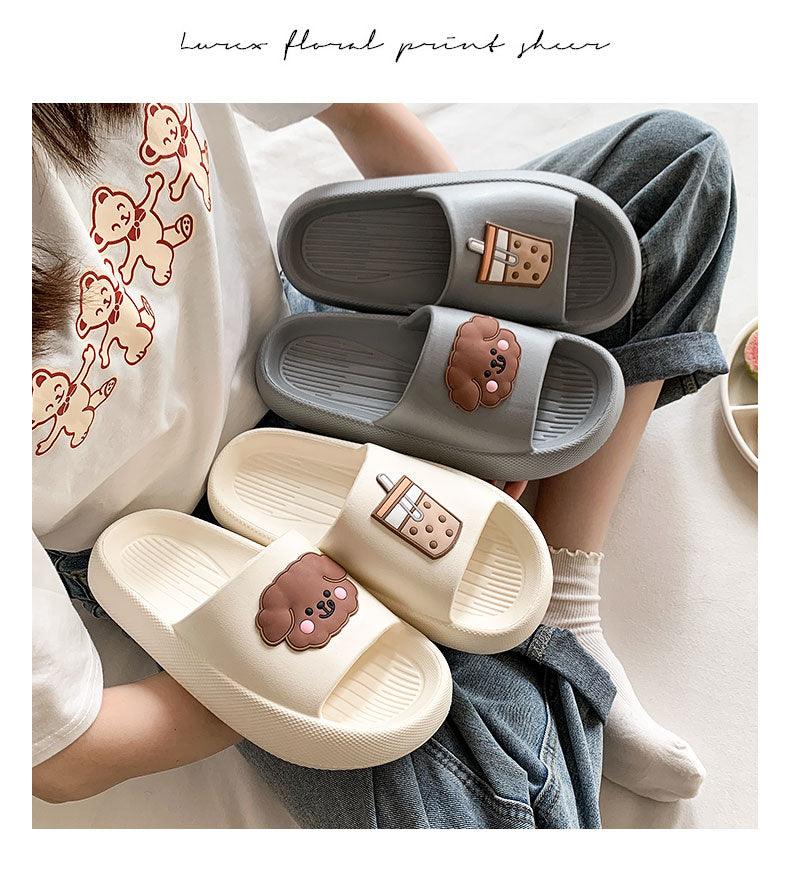 Women’s open-toe slide slippers in gray and cream with paw patches and drink icons