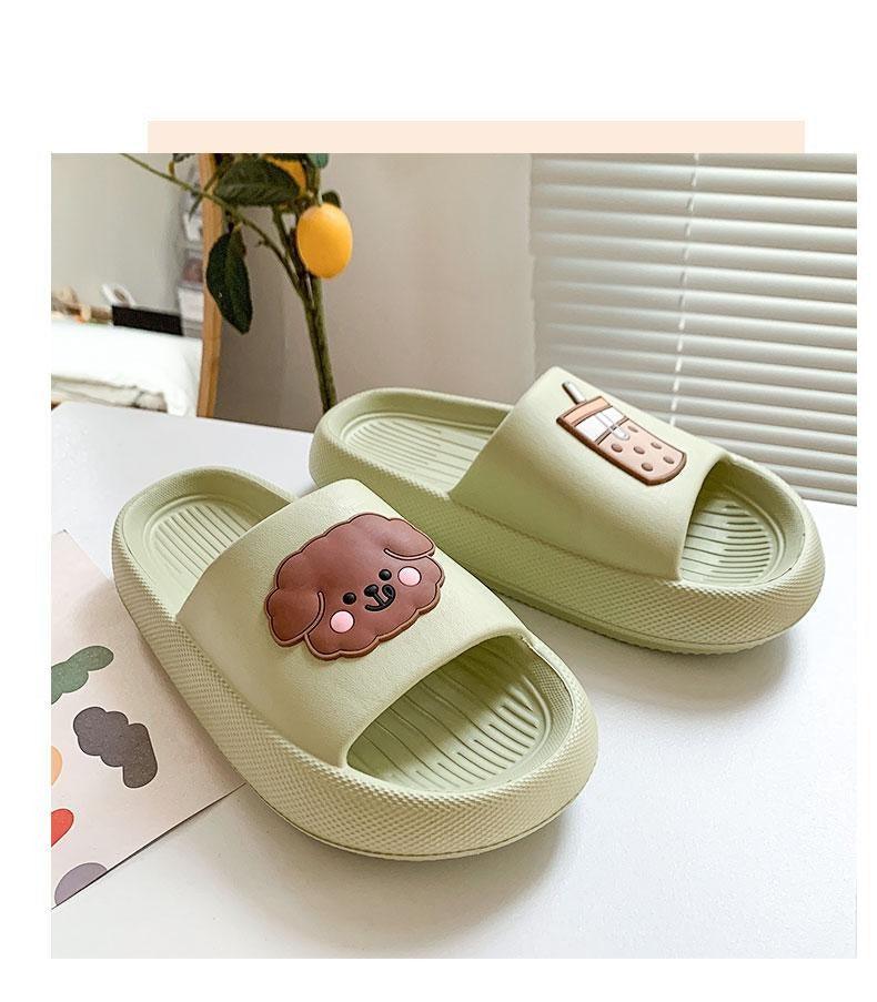 Women’s open-toe slide slippers in pale green with paw print patch and drink icon