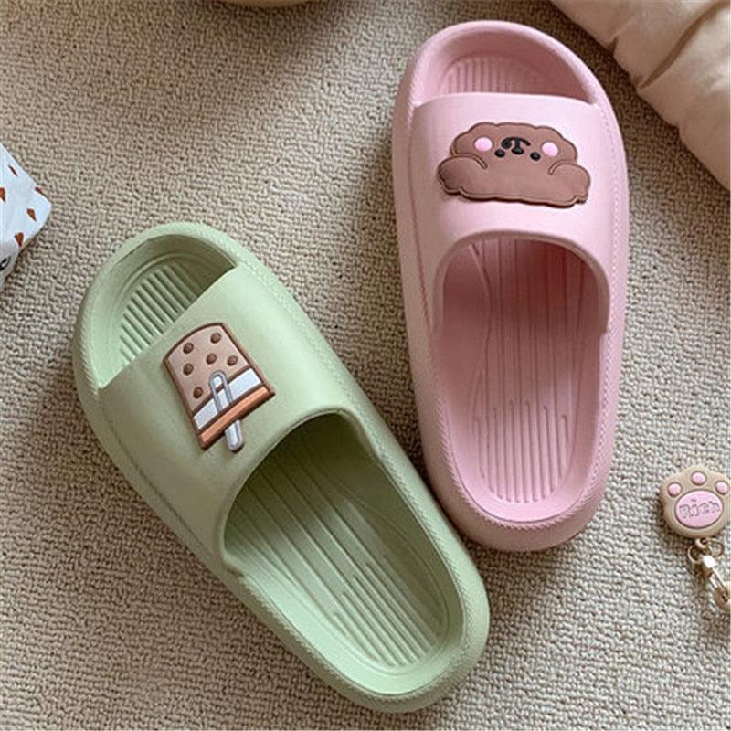 Women’s open-toe slide slippers in pink and mint green with paw patches