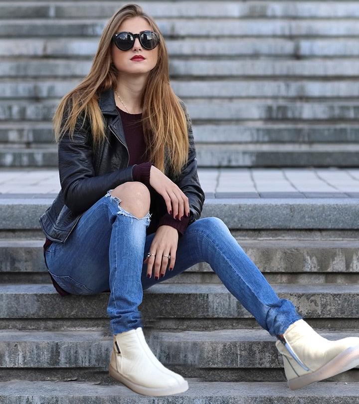 White ankle boots worn with jeans, fur-lined upper and flat sole