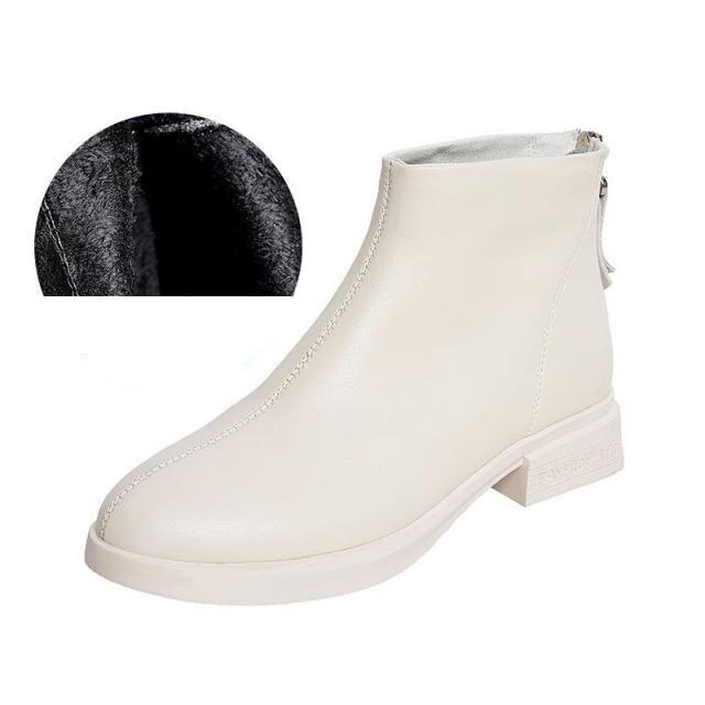 Cream ankle boots with side zipper and dark inner fur lining, block heel sole