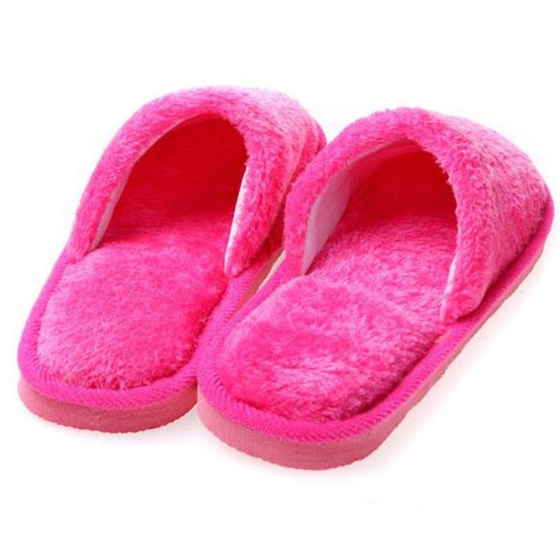 Bright pink fuzzy plush slip-on slippers with open toe and cushioned sole