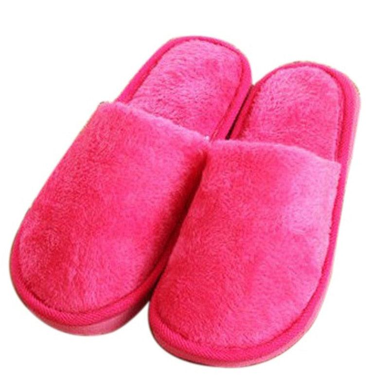 Fuchsia pink fuzzy plush slip-on slippers with open toe and rounded padded heel