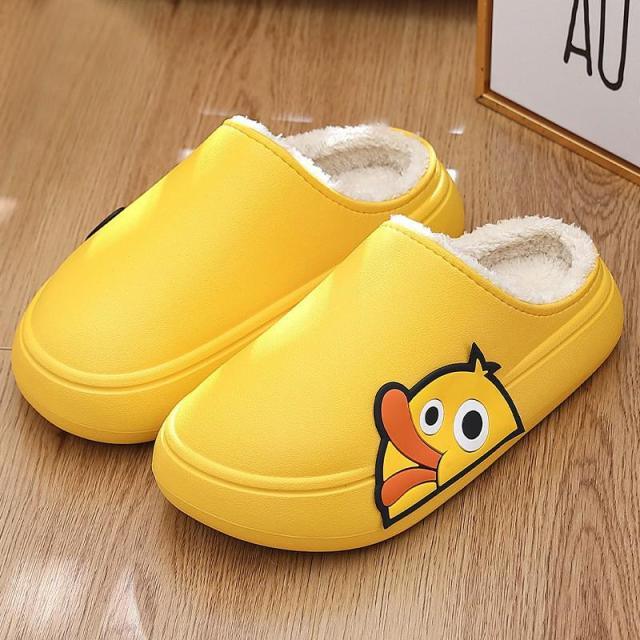 Yellow open-toe slide slippers with white fleece lining and cartoon character logo