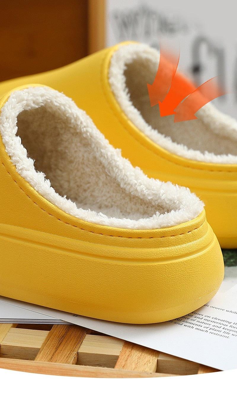 Yellow slide sandal with thick sole and white fuzzy insole, cartoon face patch