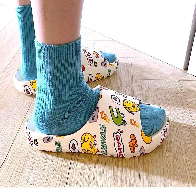 White-and-color game icon slide sandals, open toe with blue socks