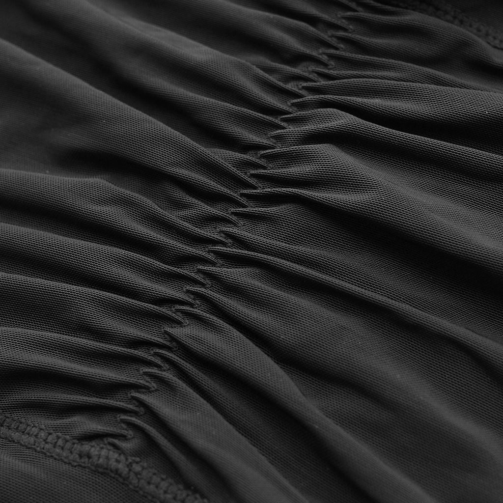 Close-up of black mesh fabric with stitched seams for high-waist shapewear
