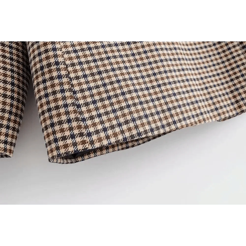 Plaid blazer hem corner close-up with folded fabric edge