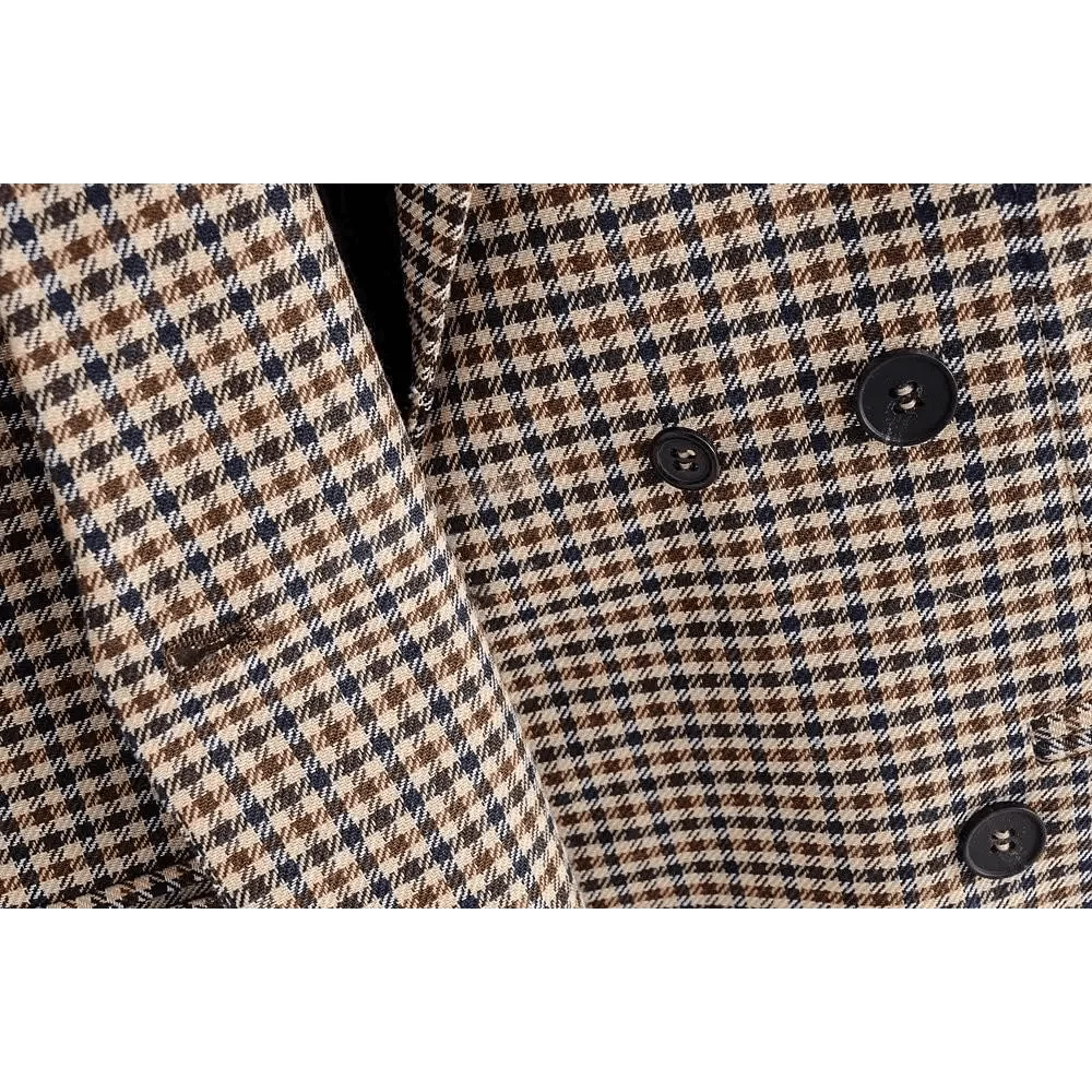 Brown plaid blazer fabric close-up with double-breasted black button detail