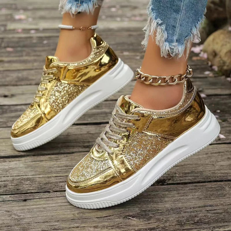 Women’s gold sequin lace-up platform sneakers with thick white sole and chain strap