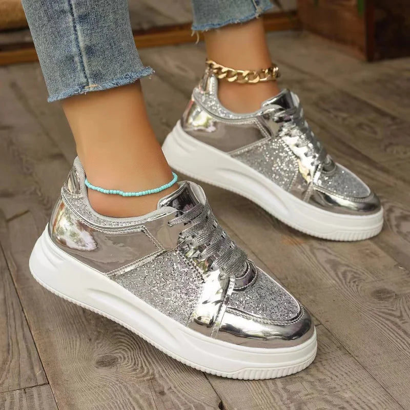 Women’s silver sequin lace-up platform sneakers with thick white sole and chain strap