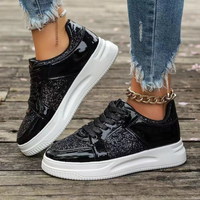 Women’s black sequin lace-up platform sneakers with thick white sole and chain strap