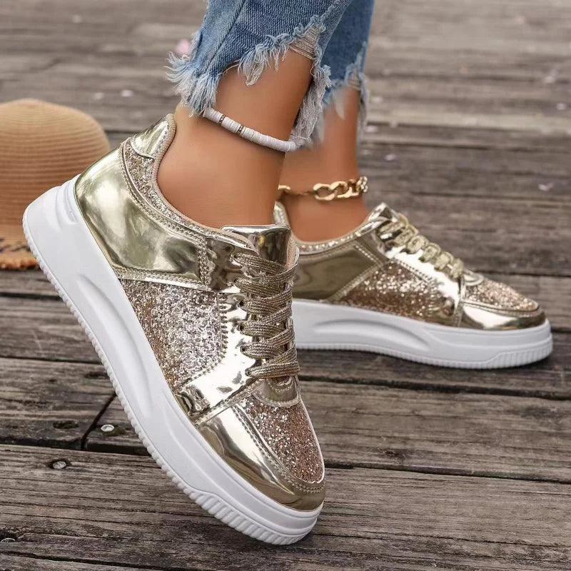Women’s gold metallic sequin lace-up platform sneakers with thick white sole and chain strap